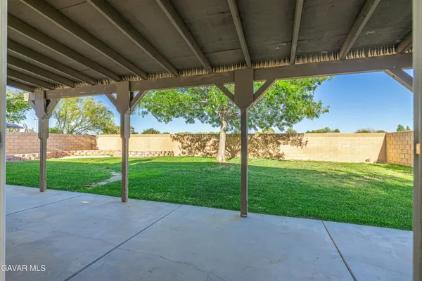a view of a yard with porch and outdoor seating