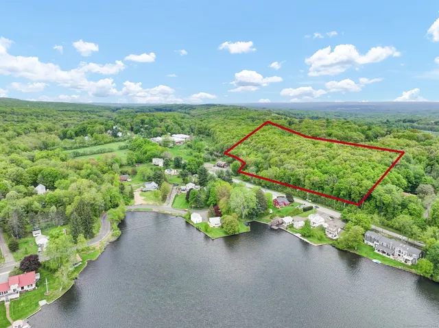 a view of a street with an ocean view