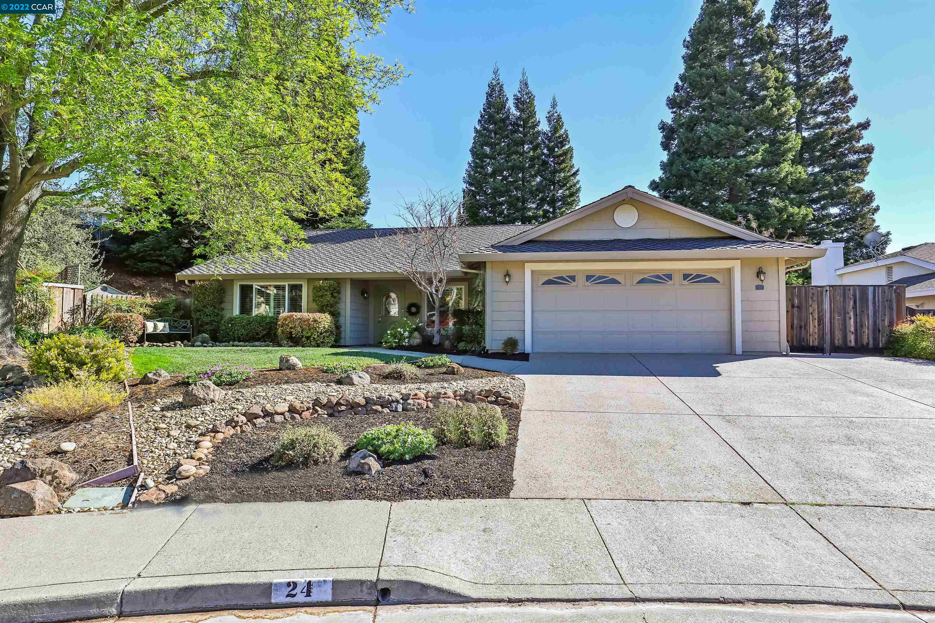 24 Shawnee Court San Ramon, CA 94583 - Photo 1 of 1 a front view of a house with a garden