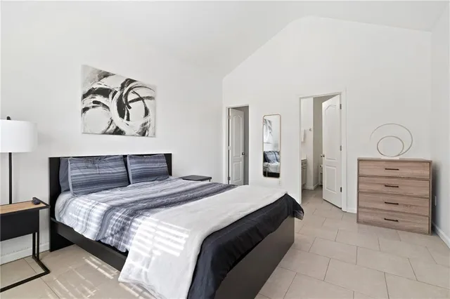 a bedroom with a bed and closet