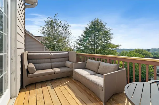 a view of a couches in the balcony