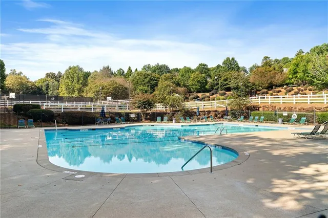 a view of a swimming pool with a patio