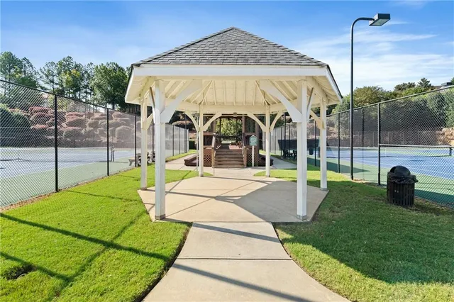 a view of a swimming pool with a yard