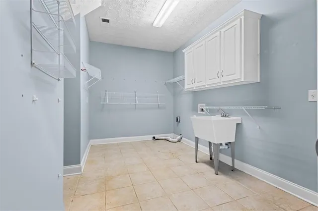 a view of an empty room and closet area