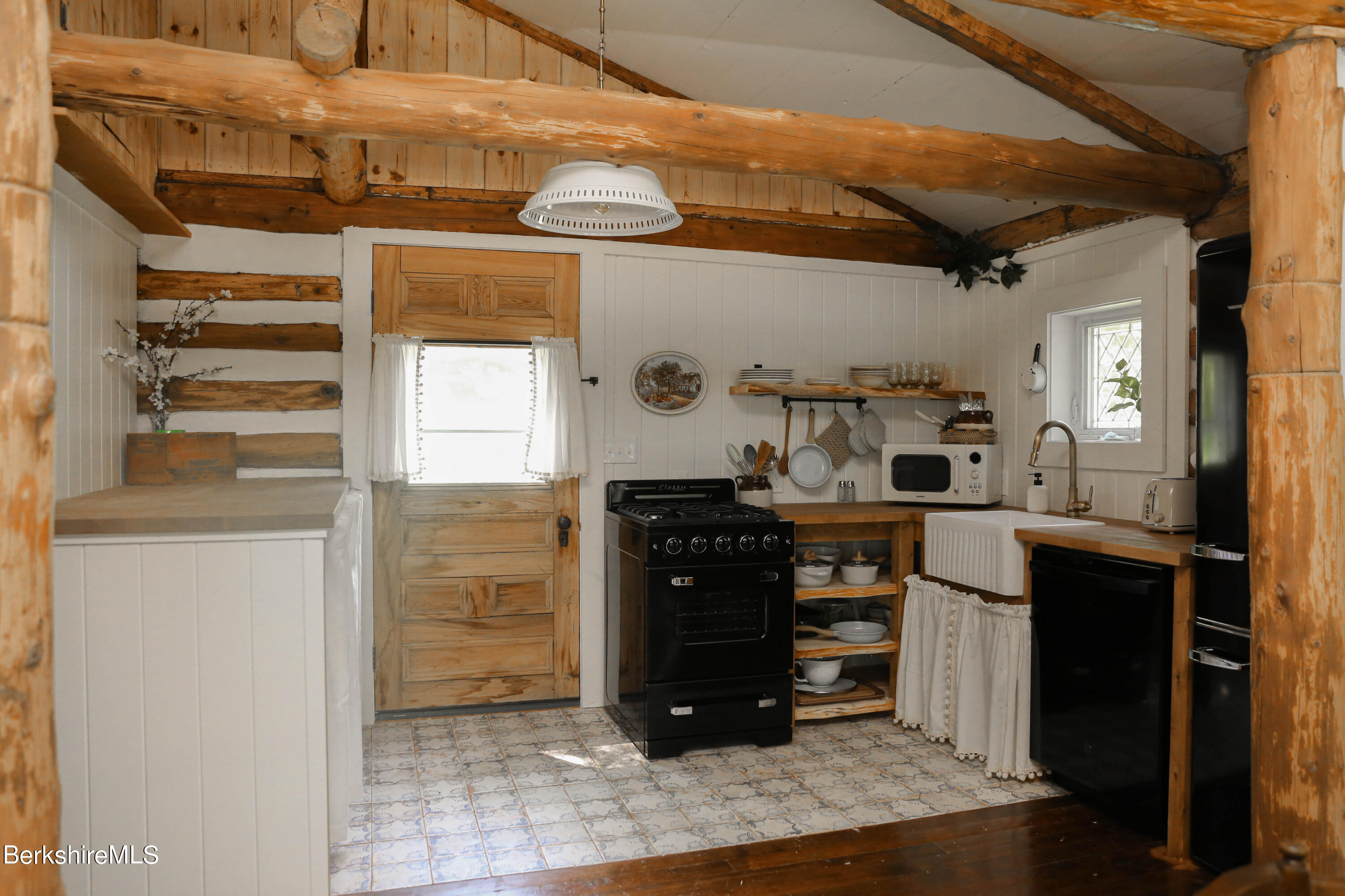 2399 Hancock Road Hancock, MA 01267 - Photo 12 of 23 a kitchen with stainless steel appliances kitchen island granite countertop a refrigerator and a stove