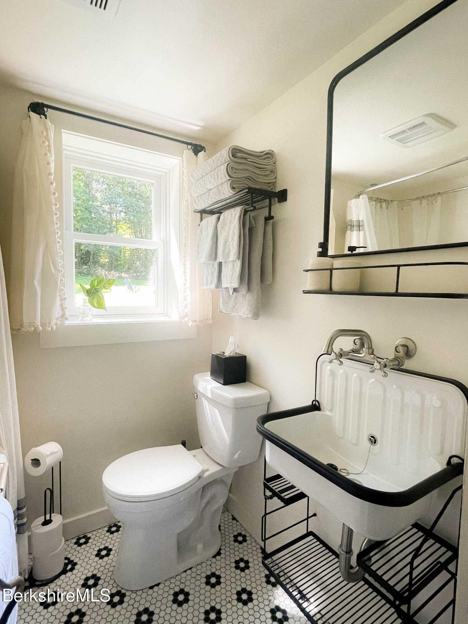 2399 Hancock Road Hancock, MA 01267 - Photo 22 of 23 a bathroom with a sink a toilet and a mirror