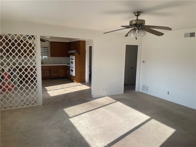 a view of a livingroom with a workspace