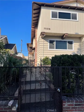 a view of a house with backyard and deck