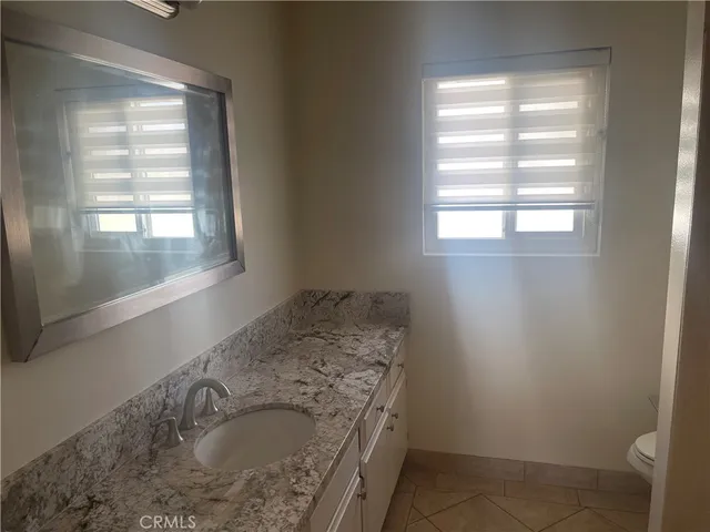 a bathroom with a sink and a window