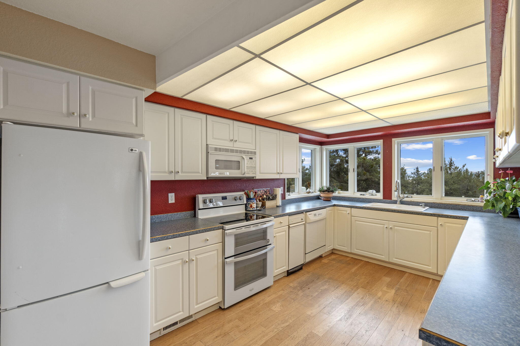 17722 Pope Road Merrill, OR 97633 - Photo 14 of 61 a kitchen with cabinets and wooden floor