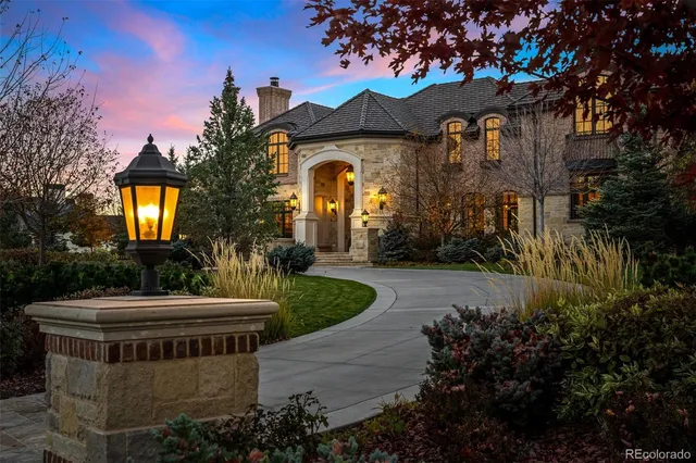 a front view of house with a garden