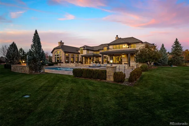 a view of a big house with a big yard