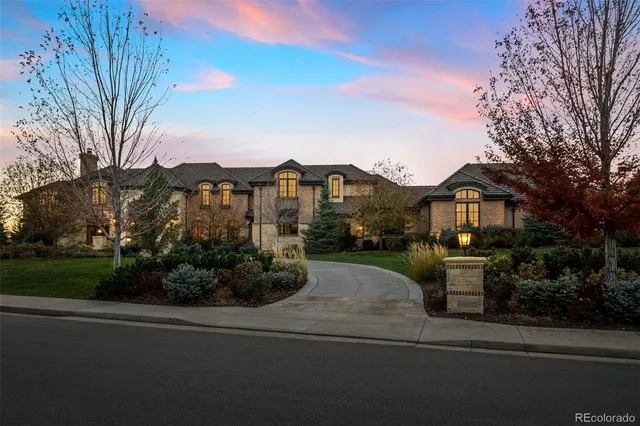 a swimming pool view with a seating space and a garden view