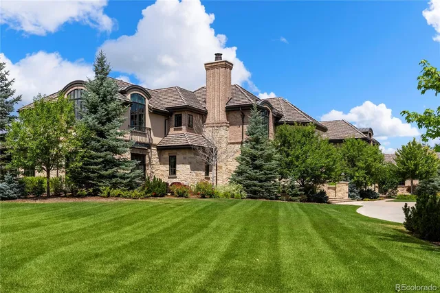 an aerial view of a house with yard swimming pool and outdoor seating