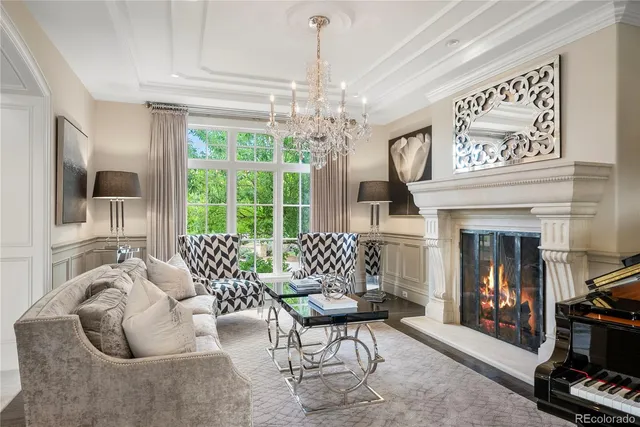 a living room with furniture a window and a fireplace