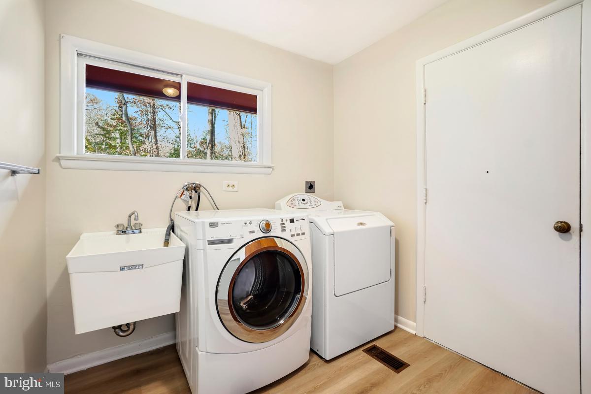 2606 Deerdell Lane Reston, VA 20191 - Photo 23 of 49 a utility room with dryer and washer