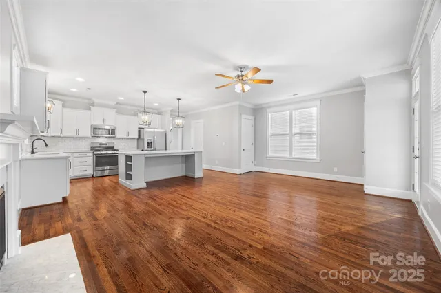 a view of kitchen with furniture and wooden floor
