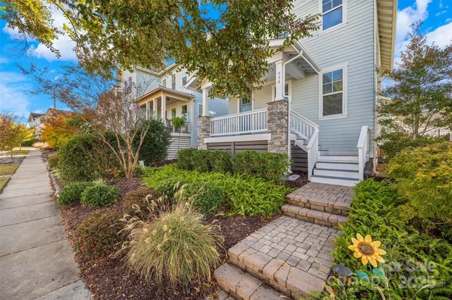 a front view of a house with garden