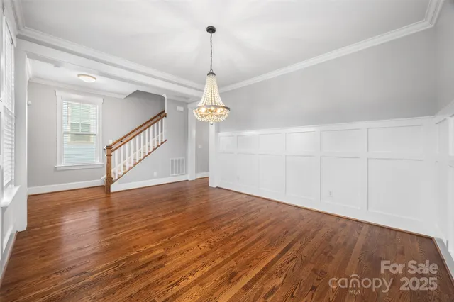 a view of an entryway with wooden floor