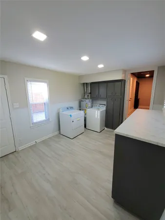 a room with a bed and a night stand