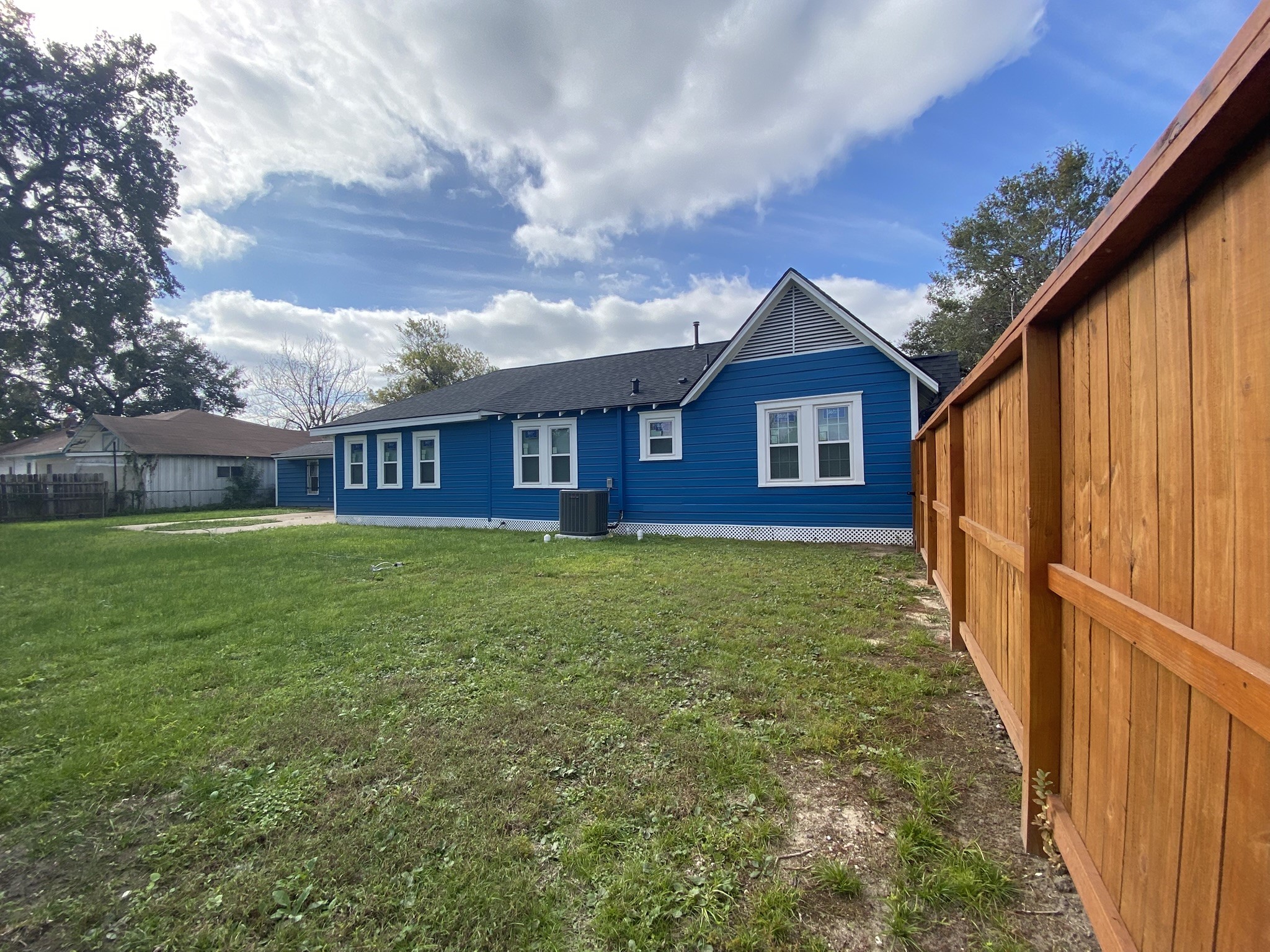 628 King Street Houston, TX 77022 - Photo 16 of 24 a view of a house with a small yard and wooden fence