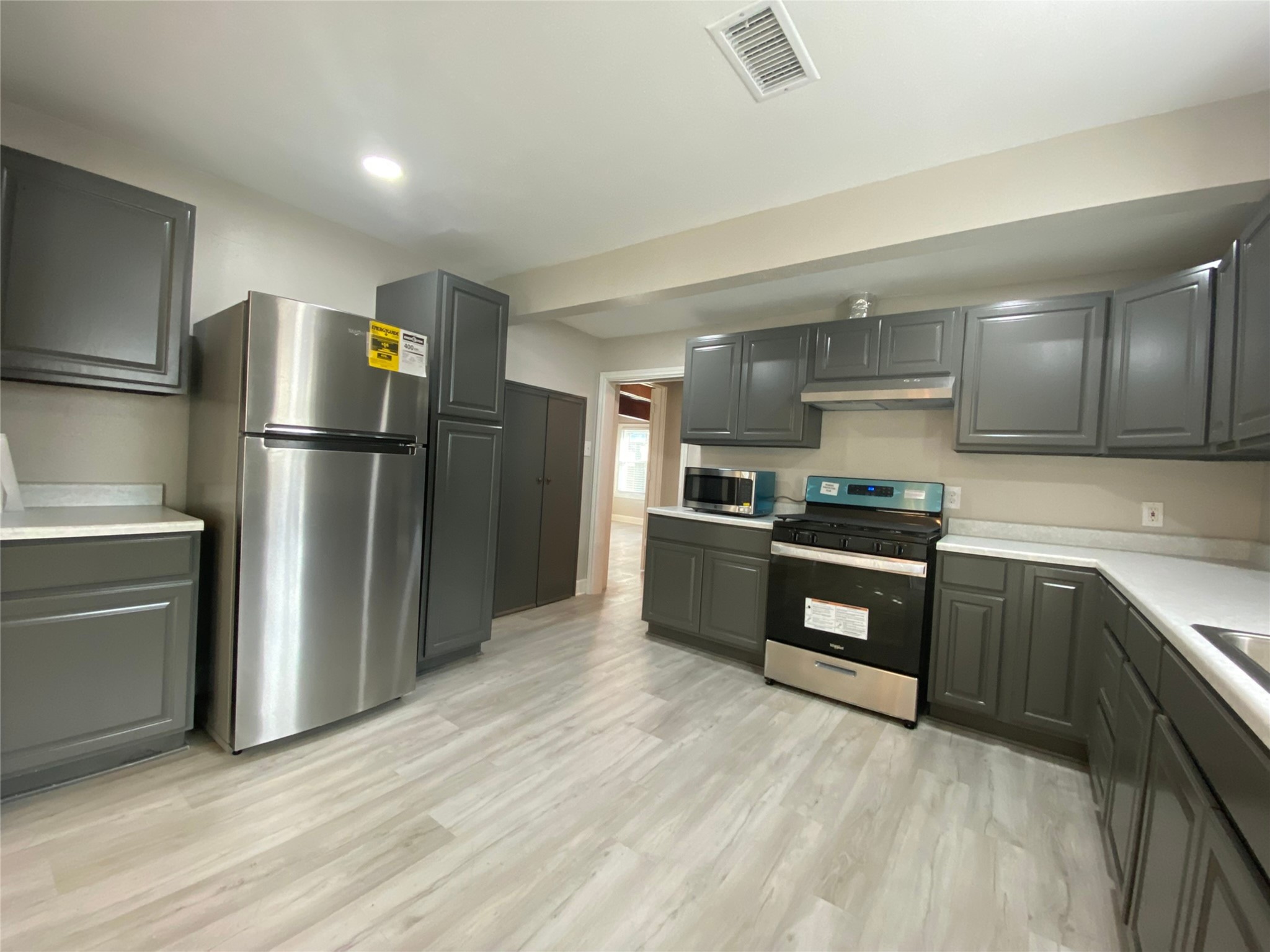 628 King Street Houston, TX 77022 - Photo 10 of 24 a kitchen with a refrigerator and a sink