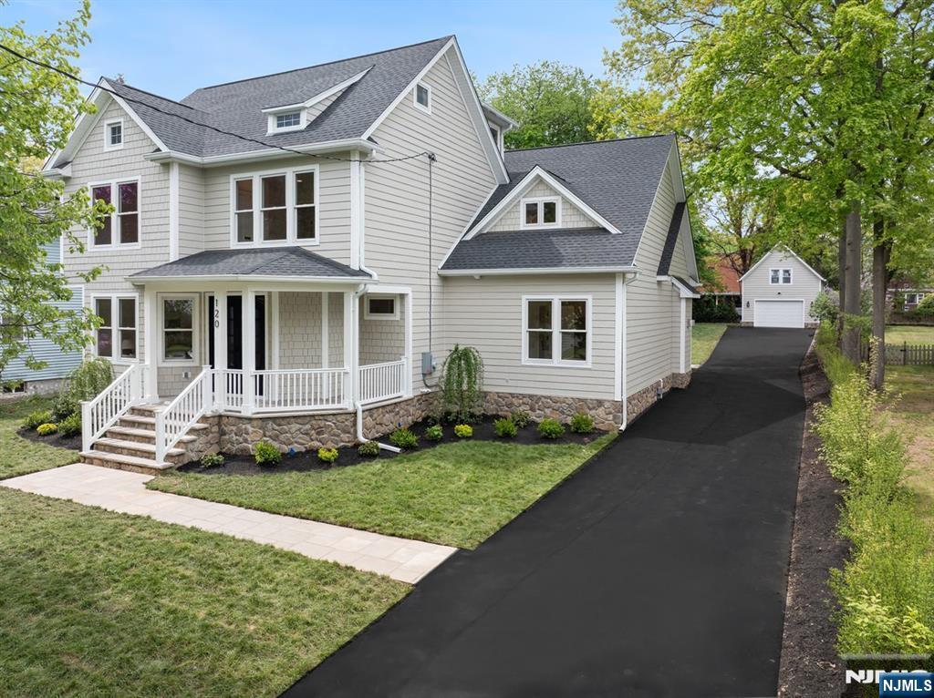 120 Hope Street Ridgewood, NJ 07450 - Photo 32 of 37 a front view of a house with a yard