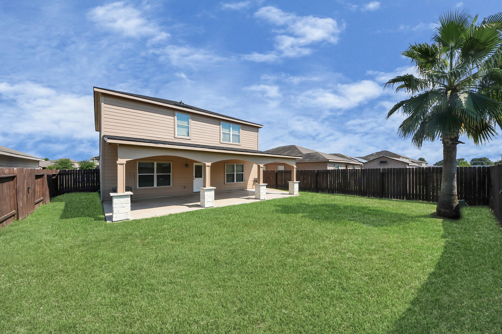 6931 Primrose Road Baytown, TX 77521 - Photo 46 of 50 Large fenced backyard with covered patio, ideal for gatherings, play, and outdoor living.
