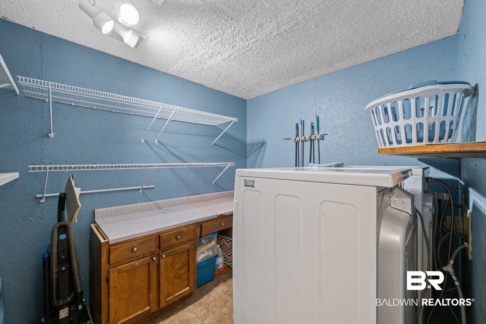 40 Caisson Trace Daphne, AL 36527 - Photo 20 of 54 Washroom featuring light tile patterned flooring, washer / dryer.