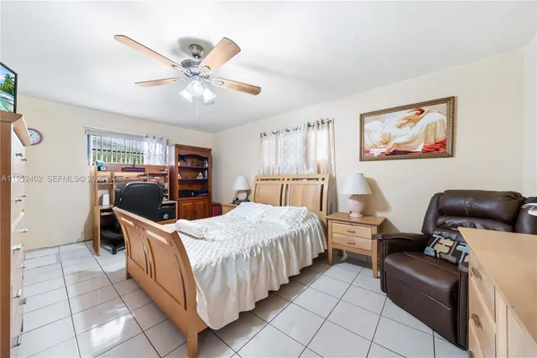 a room with a bed and furniture