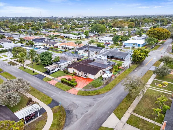 an aerial view of a house with a swimming pool