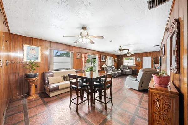 a view of a dining room with furniture window and outside view