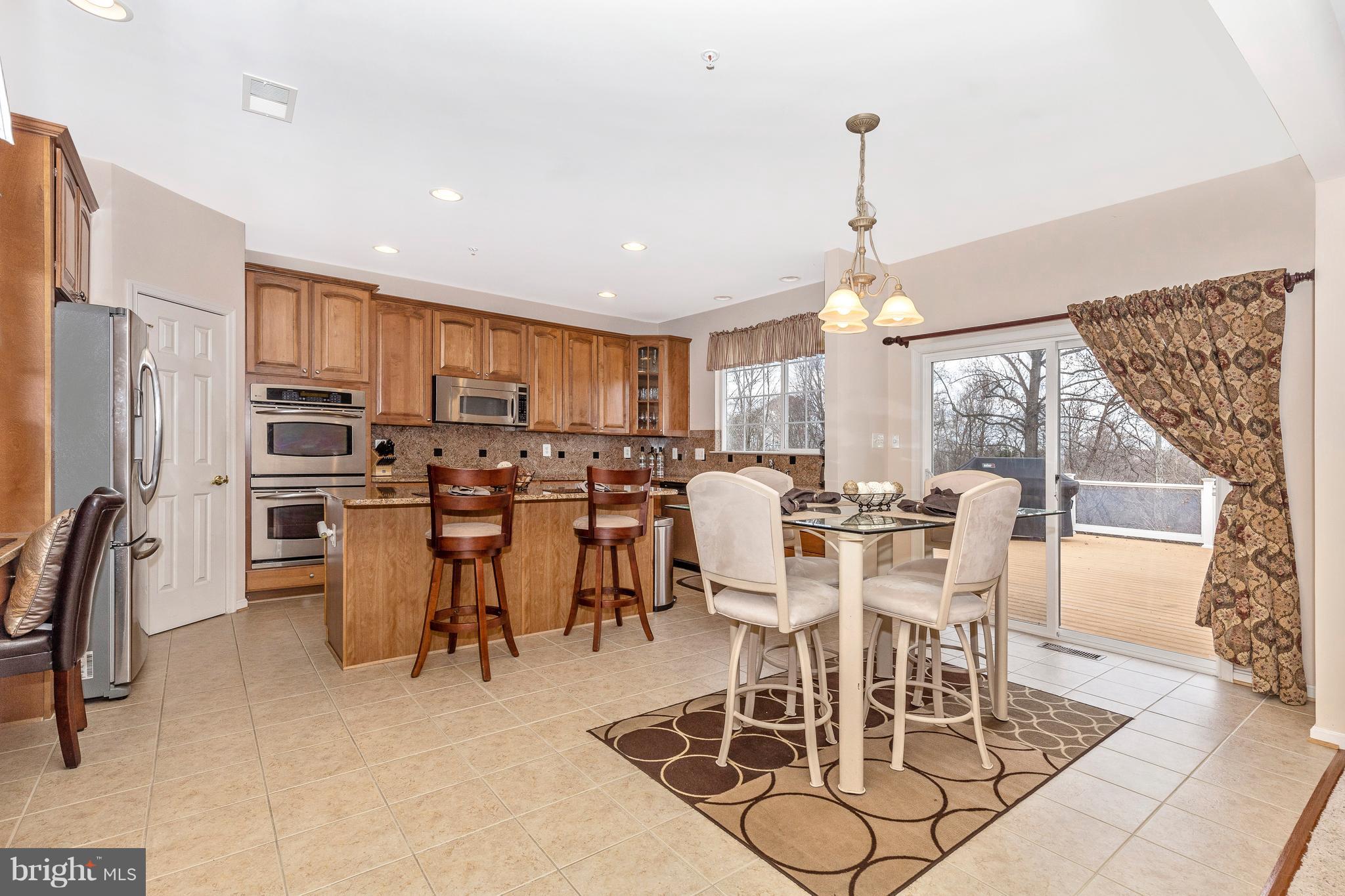 14513 Bubbling Spring Road Boyds, MD 20841 - Photo 12 of 57 a view of a dining room with furniture window and outside view
