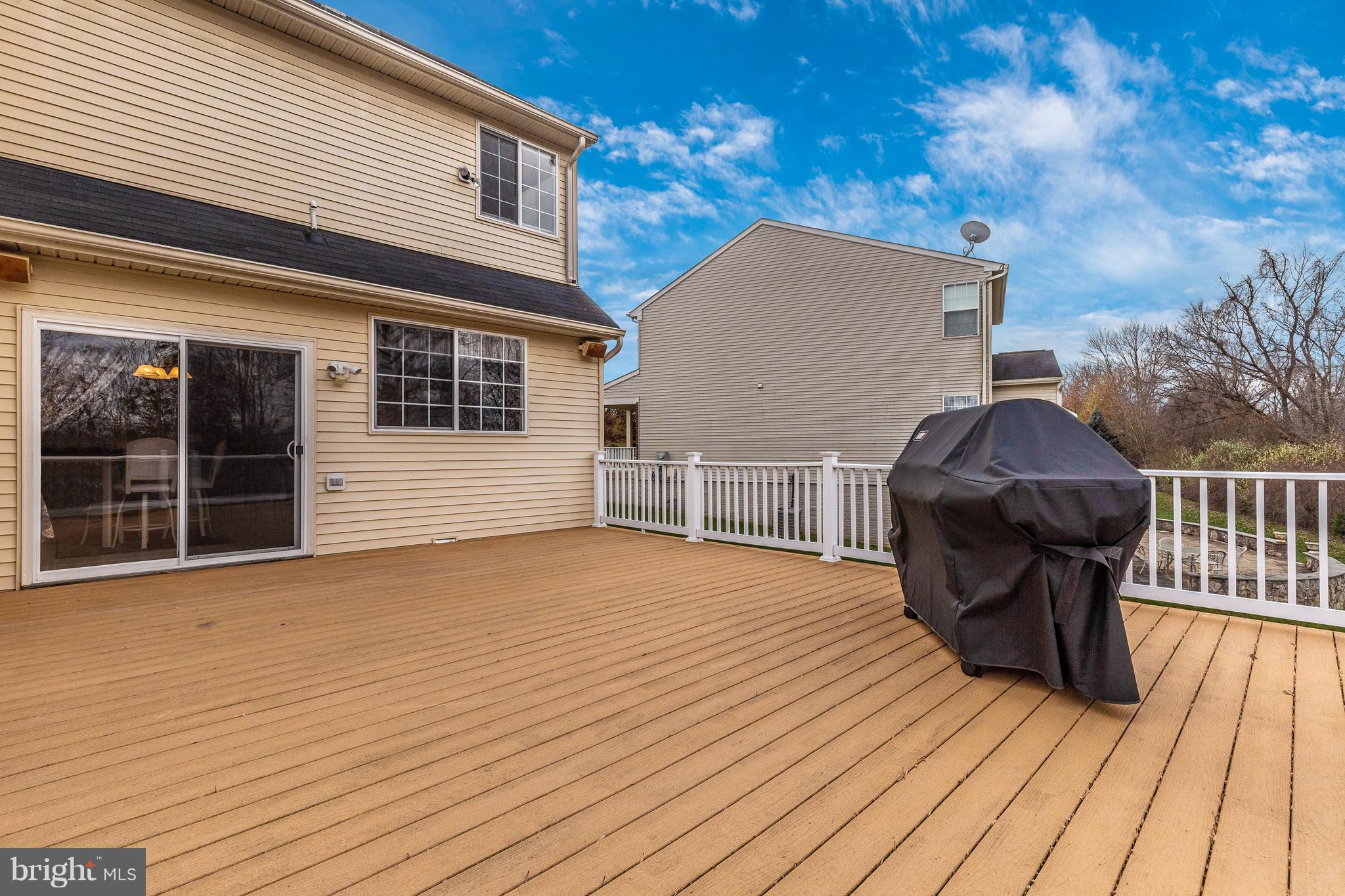 14513 Bubbling Spring Road Boyds, MD 20841 - Photo 20 of 57 a view of a house with wooden deck and furniture