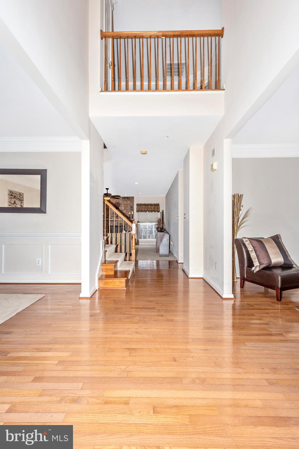 14513 Bubbling Spring Road Boyds, MD 20841 - Photo 3 of 57 a view of livingroom with dining room and wooden floor