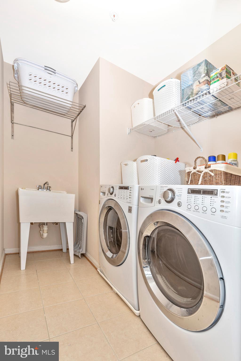 14513 Bubbling Spring Road Boyds, MD 20841 - Photo 21 of 57 a utility room with dryer and washer
