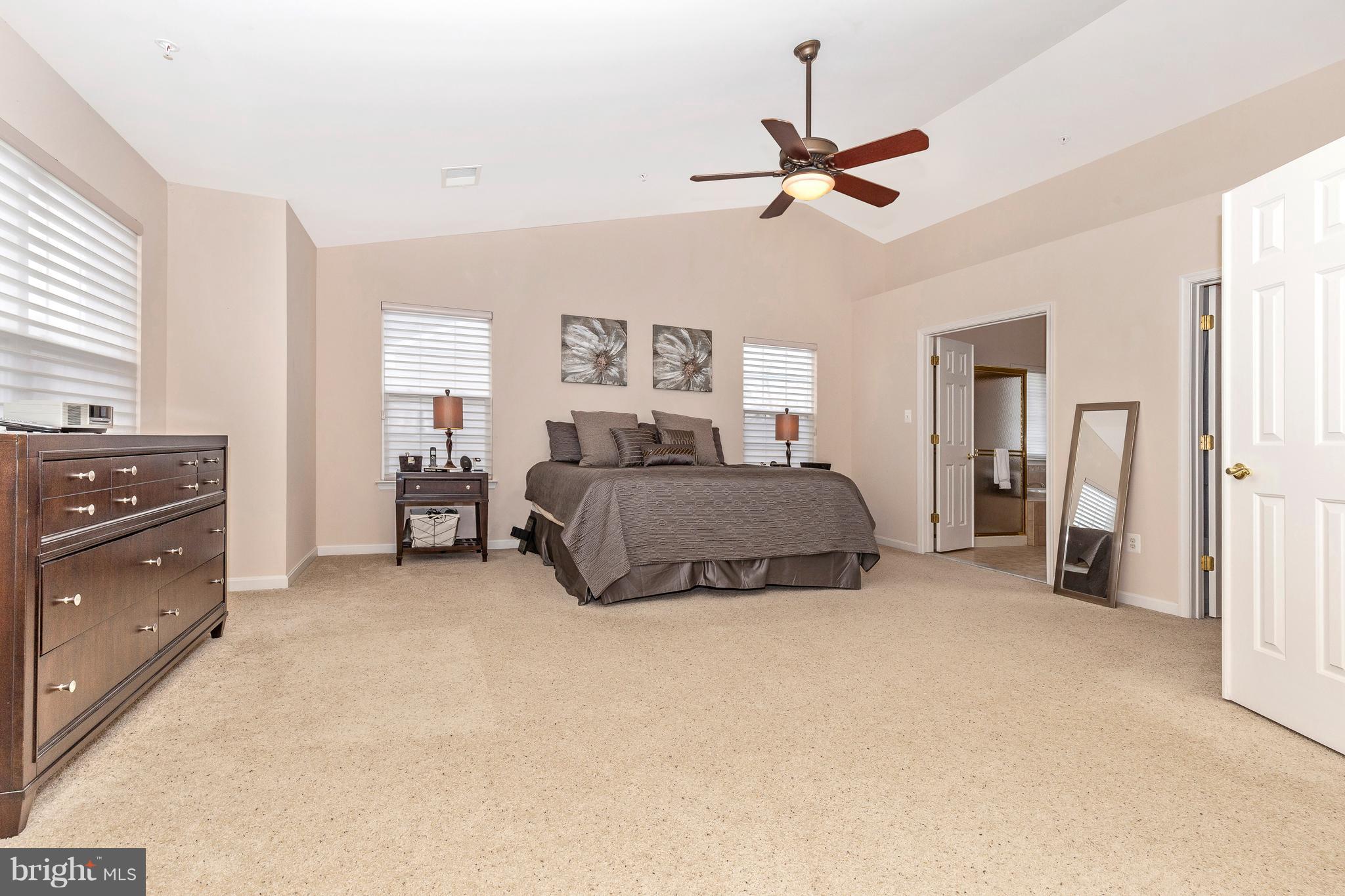 14513 Bubbling Spring Road Boyds, MD 20841 - Photo 22 of 57 a living room with furniture and a ceiling fan