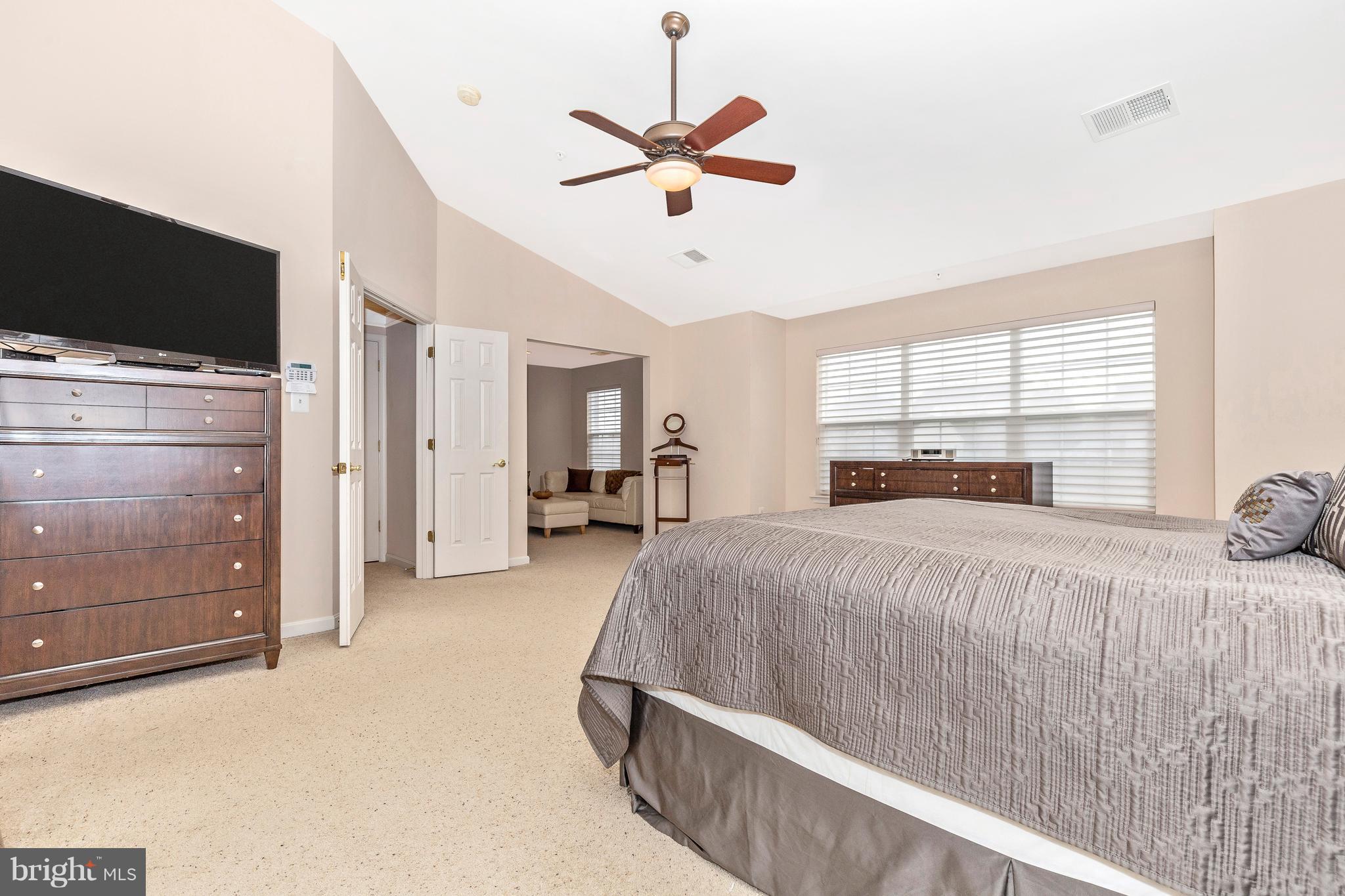 14513 Bubbling Spring Road Boyds, MD 20841 - Photo 23 of 57 a bed room with a bed and a television