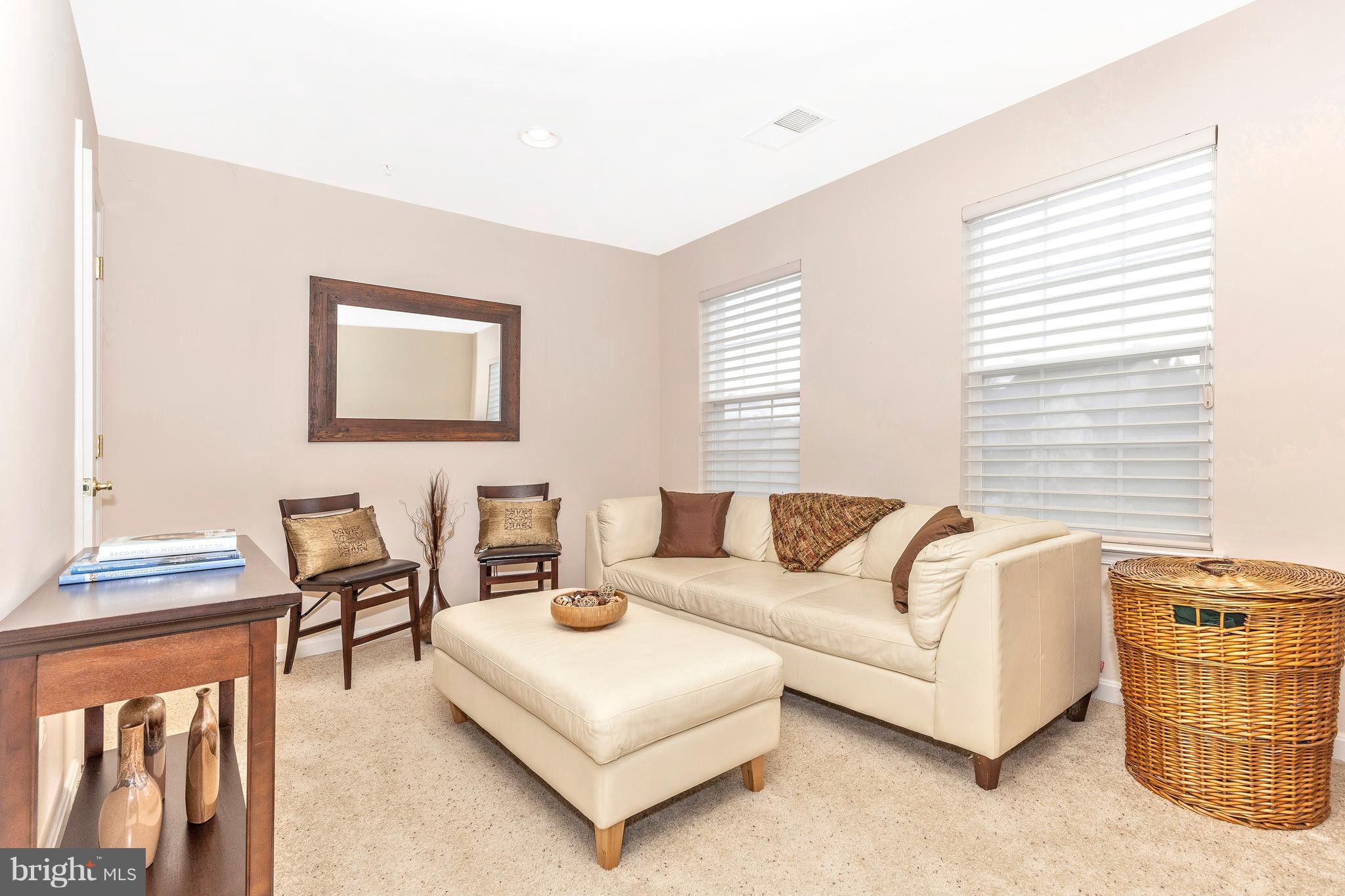 14513 Bubbling Spring Road Boyds, MD 20841 - Photo 25 of 57 a living room with furniture and a window