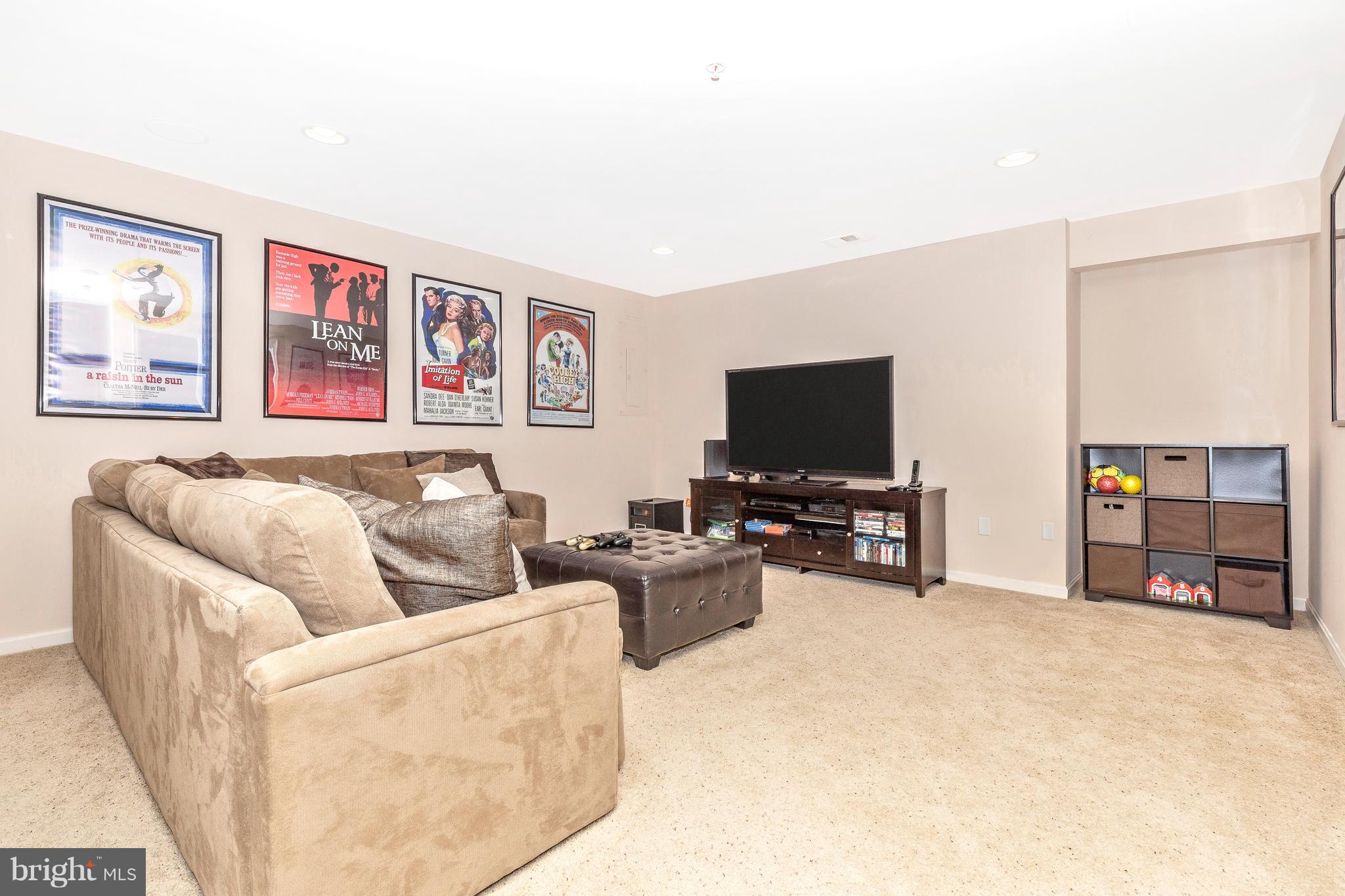 14513 Bubbling Spring Road Boyds, MD 20841 - Photo 33 of 57 a living room with furniture and a flat screen tv