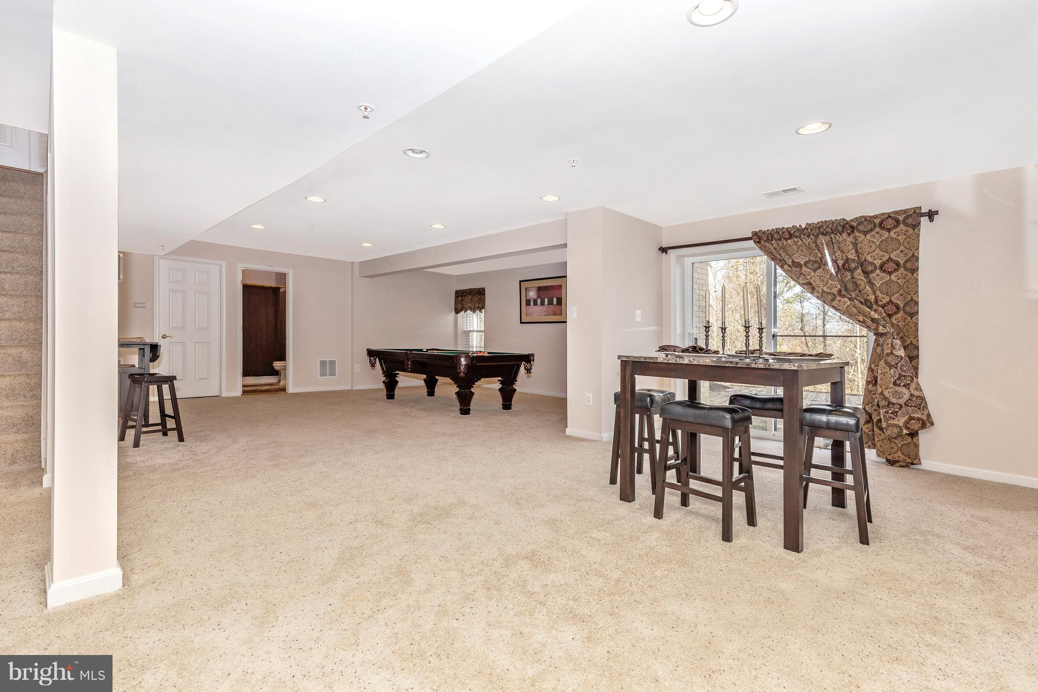 14513 Bubbling Spring Road Boyds, MD 20841 - Photo 34 of 57 a view of a livingroom with furniture and a flat screen tv