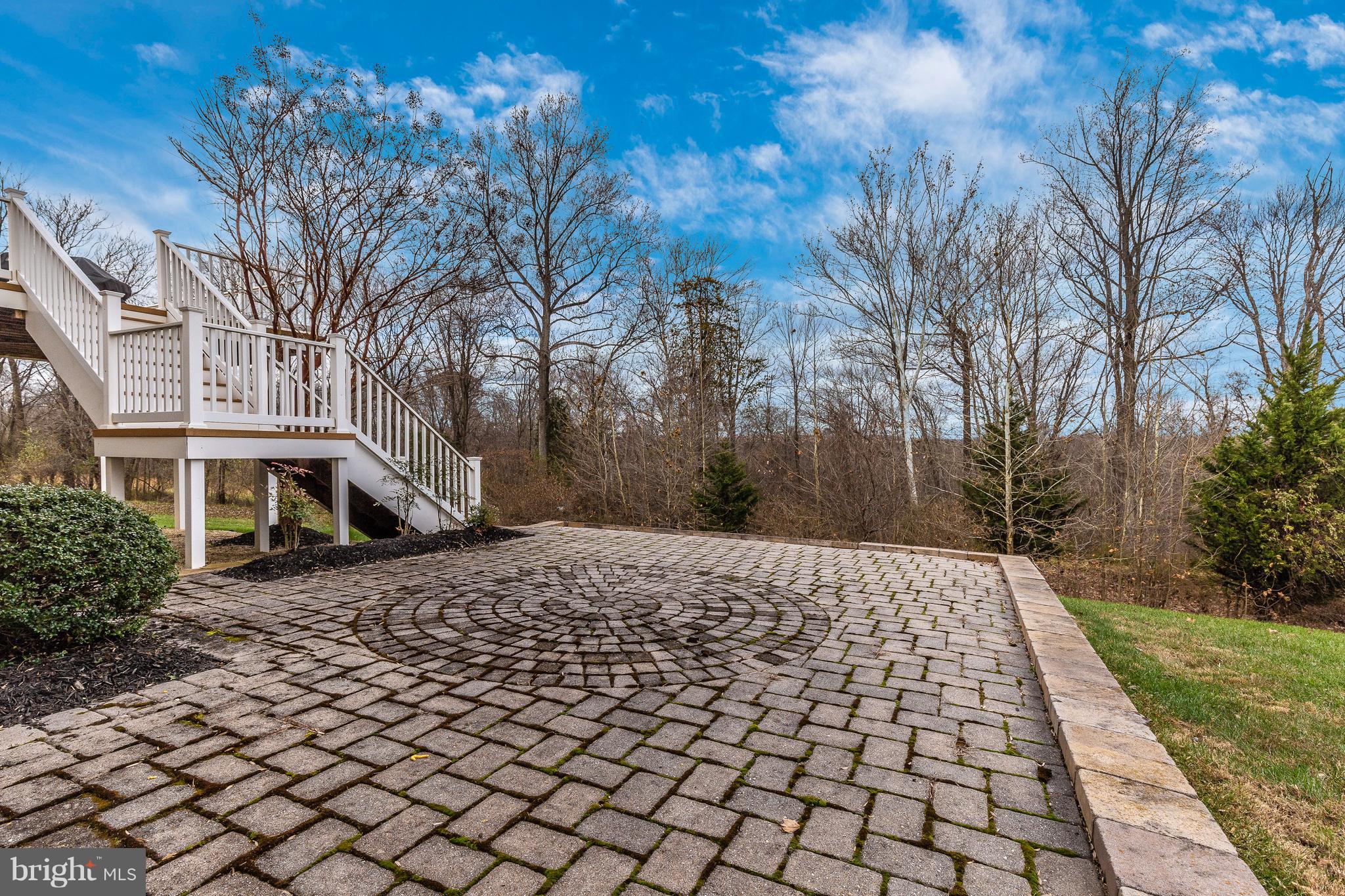 14513 Bubbling Spring Road Boyds, MD 20841 - Photo 39 of 57 a pathway of a house with yard and trees in the background