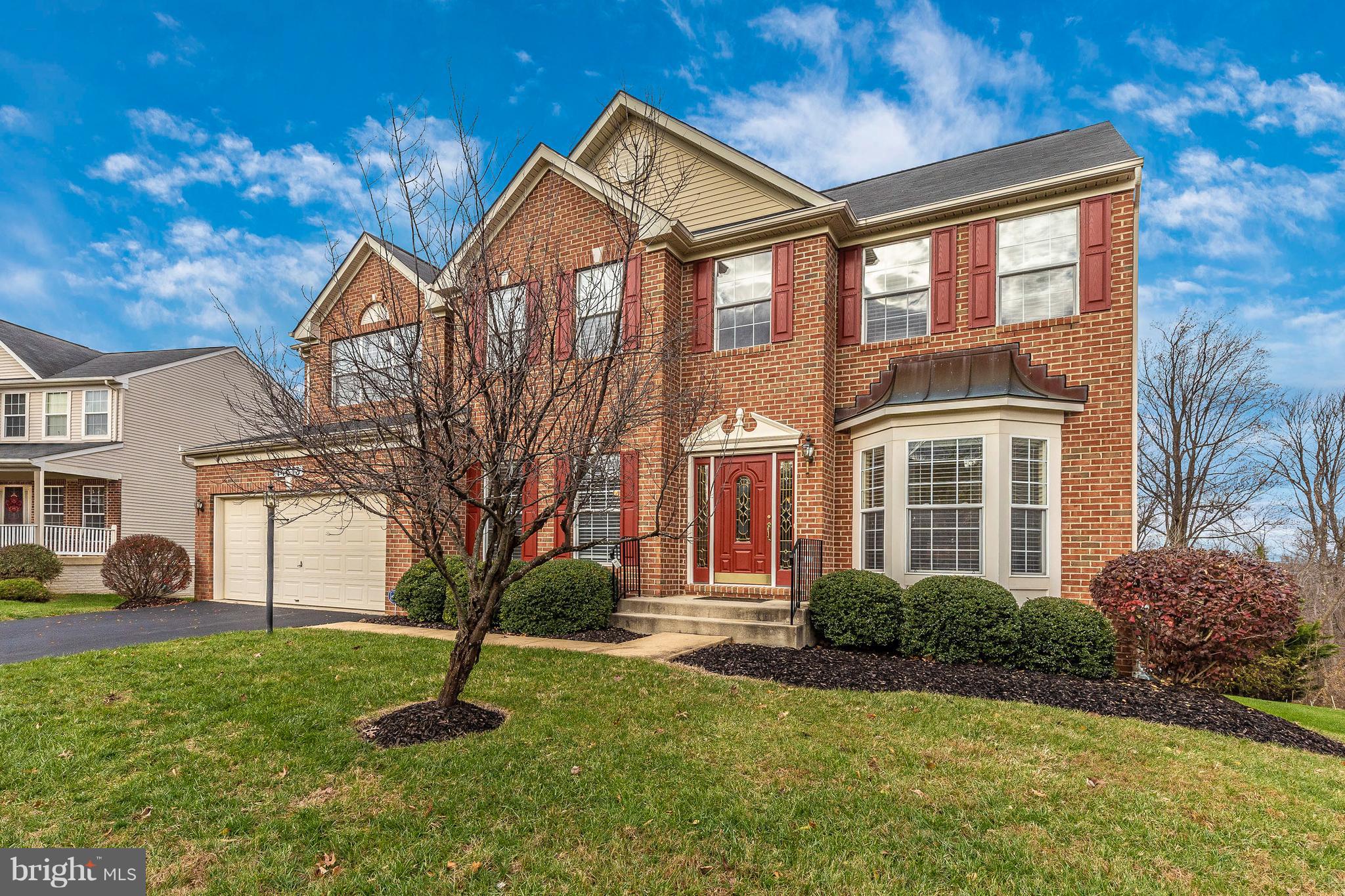 14513 Bubbling Spring Road Boyds, MD 20841 - Photo 43 of 57 a front view of a house with a yard