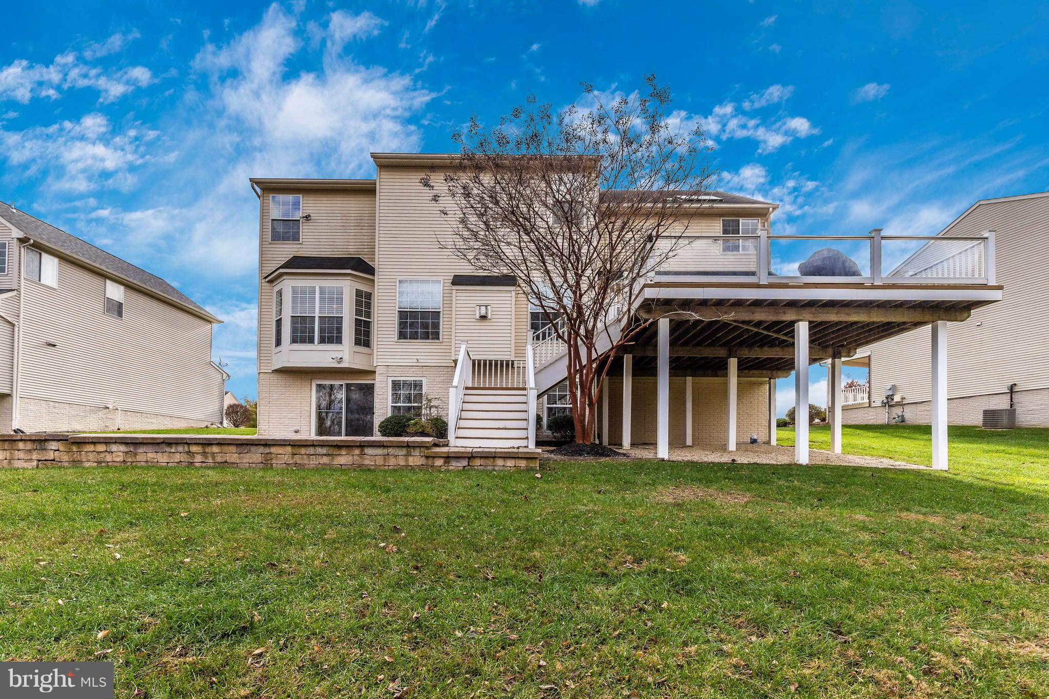 14513 Bubbling Spring Road Boyds, MD 20841 - Photo 46 of 57 a front view of a house with a yard