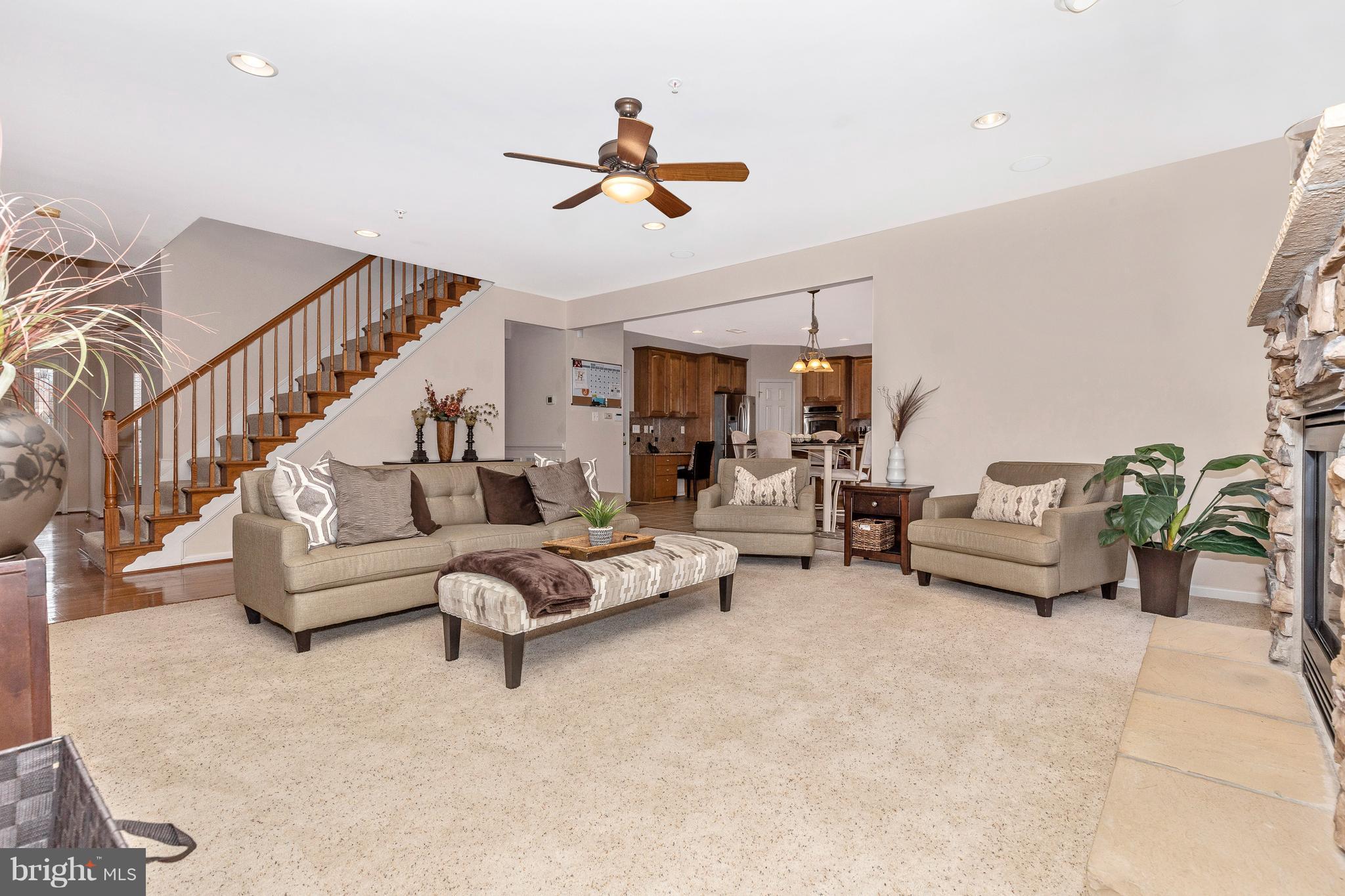 14513 Bubbling Spring Road Boyds, MD 20841 - Photo 10 of 57 a living room with furniture and a chandelier