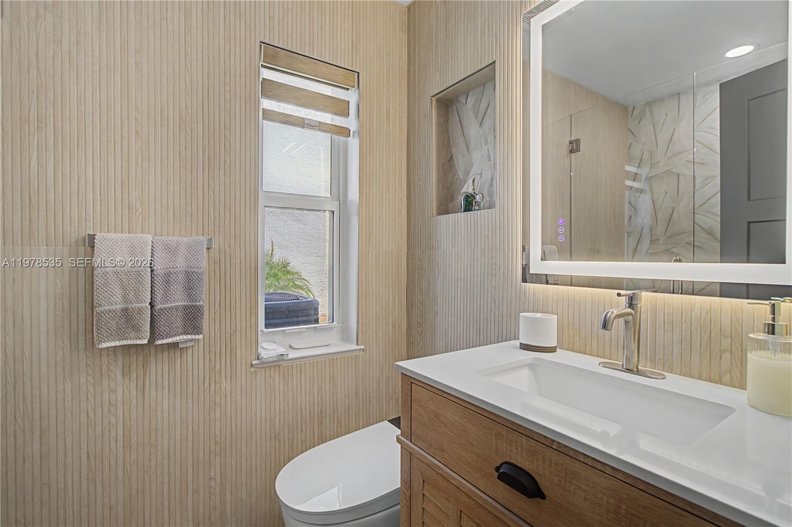 140 Eveningstar Cay Naples, FL 34114 - Photo 27 of 51 a bathroom with a sink a toilet and shower
