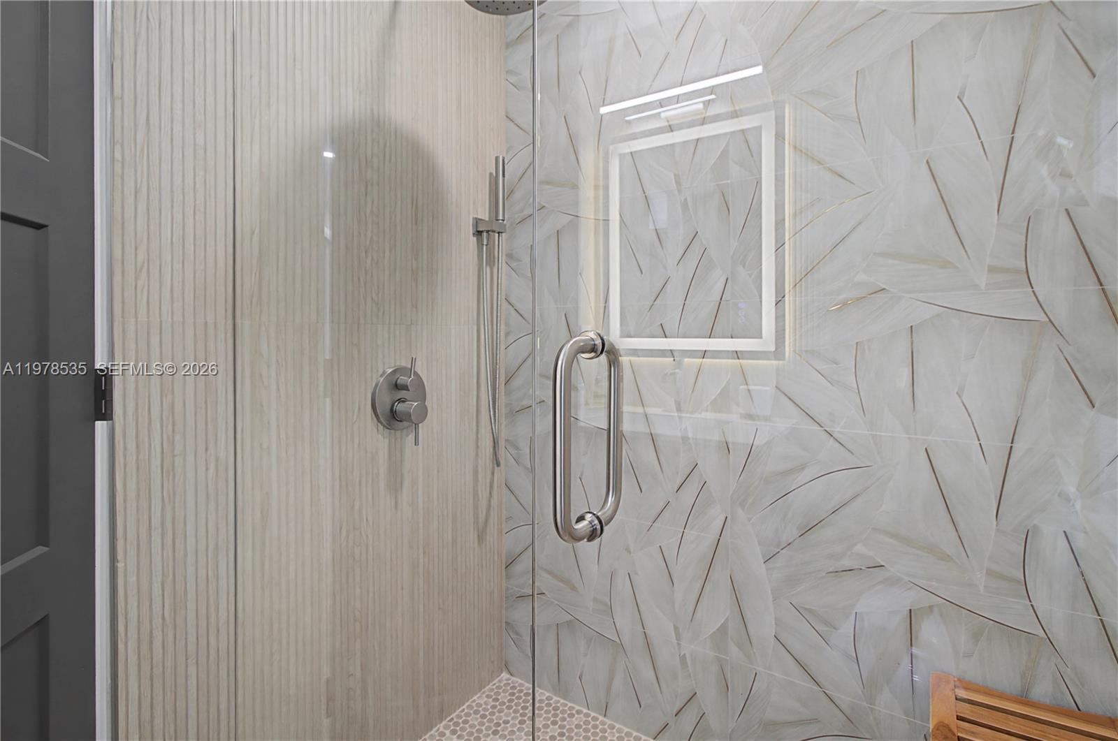 140 Eveningstar Cay Naples, FL 34114 - Photo 28 of 51 a bathroom with a shower