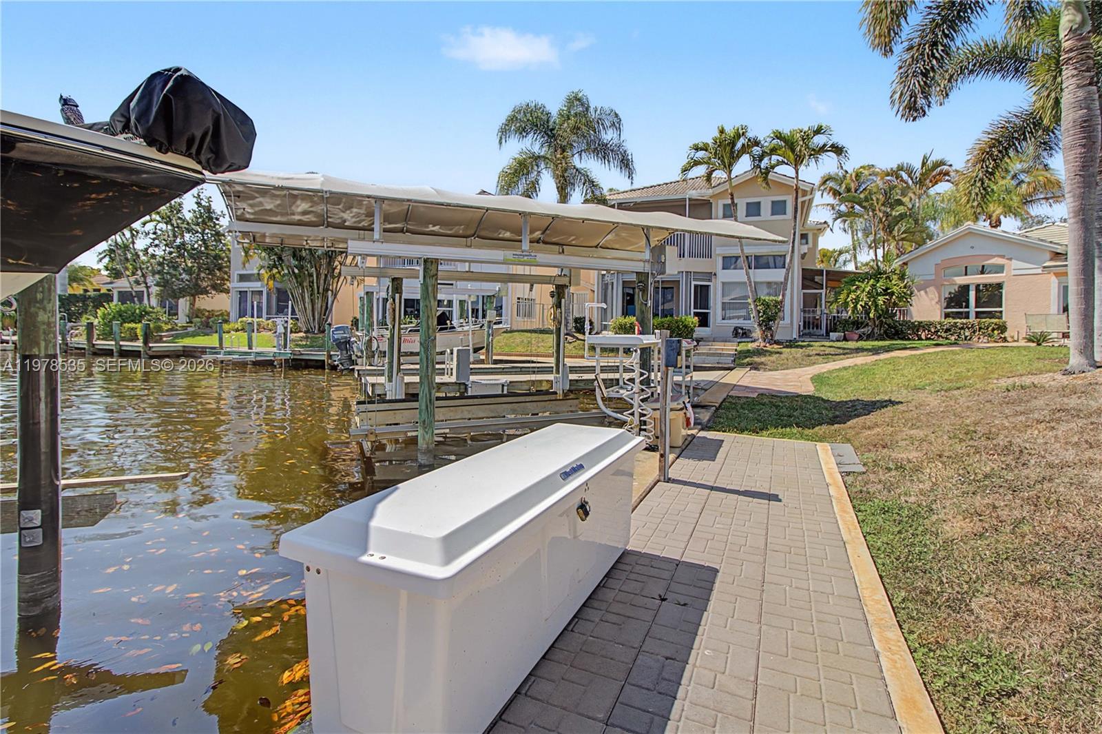 140 Eveningstar Cay Naples, FL 34114 - Photo 48 of 51 a view of a building with lake view