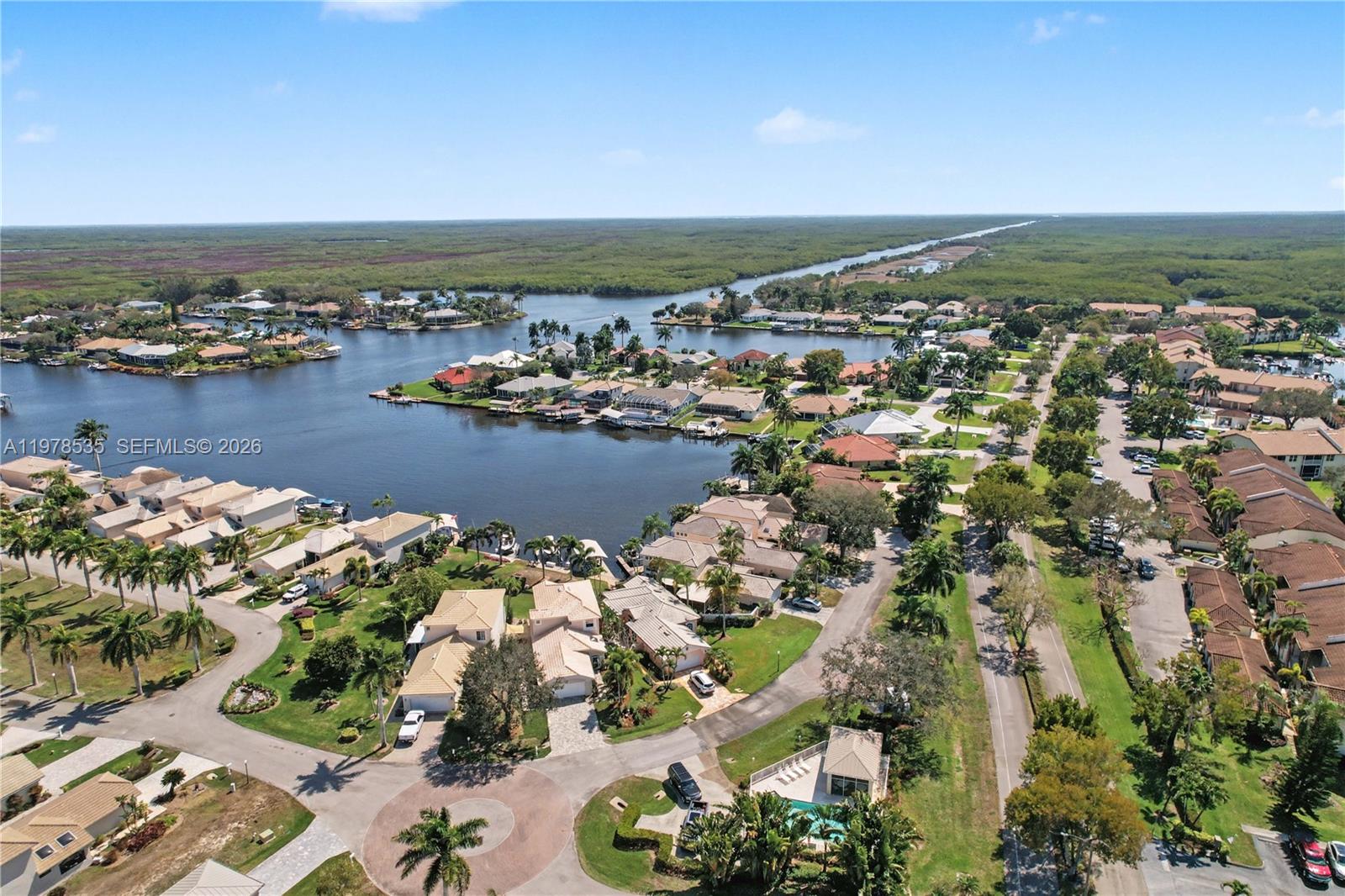 140 Eveningstar Cay Naples, FL 34114 - Photo 49 of 51 an aerial view of ocean and residential houses with outdoor space