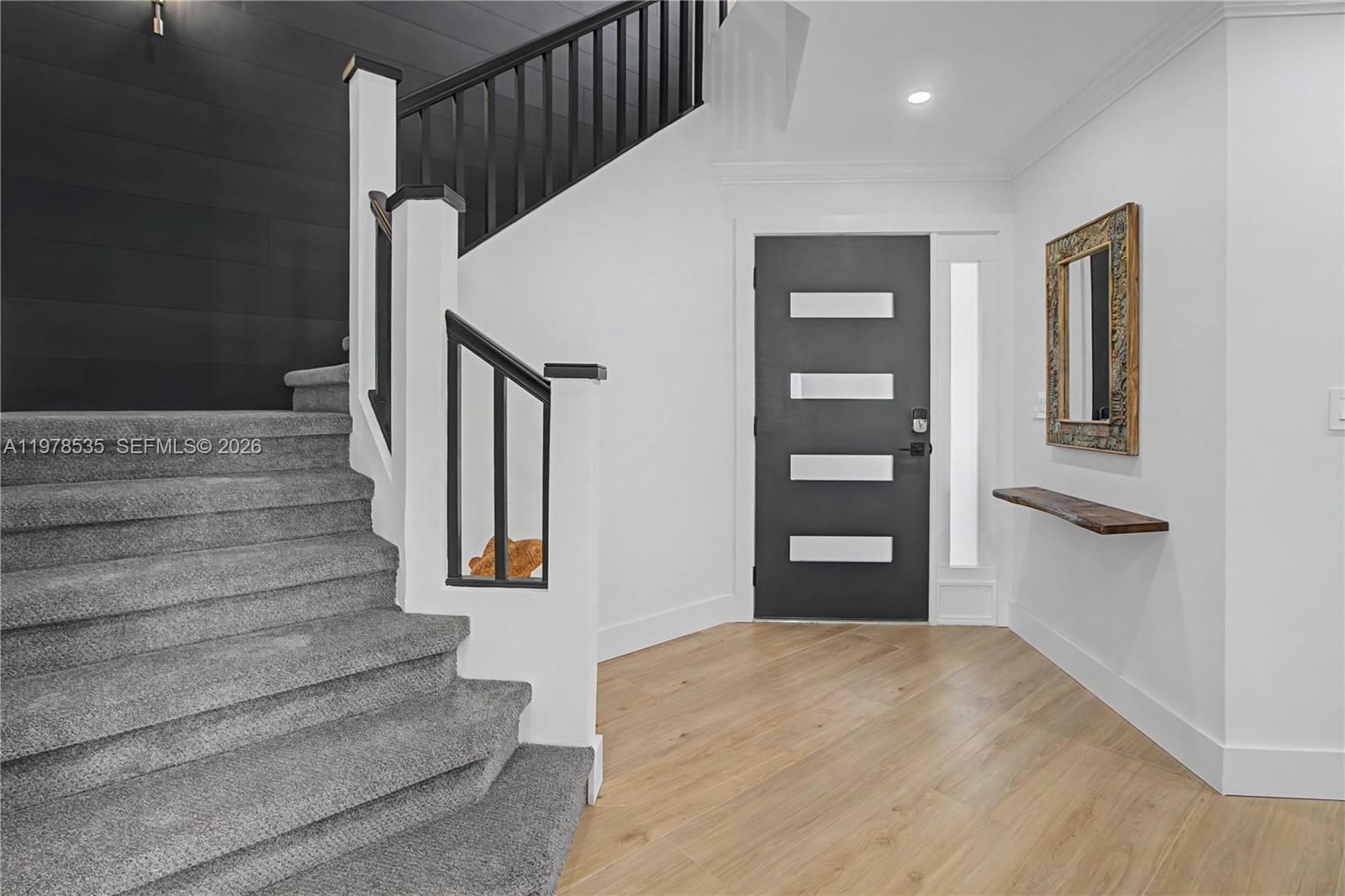 140 Eveningstar Cay Naples, FL 34114 - Photo 5 of 51 a view of entryway and hall with wooden floor
